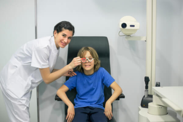 Young boy having his eyes tested